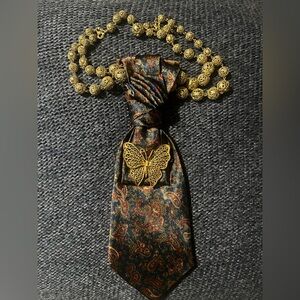 Gold Butterfly Tie Pin on Paisley Navy Tie